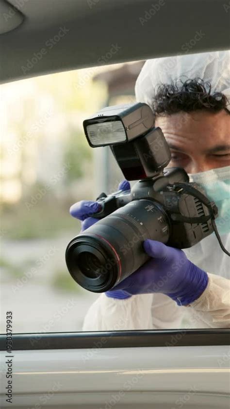 Forensic Photographer And Car Investigation At Crime Scene For