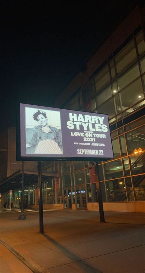 A Large Sign On The Side Of A Building That Says Harry Styles Only In