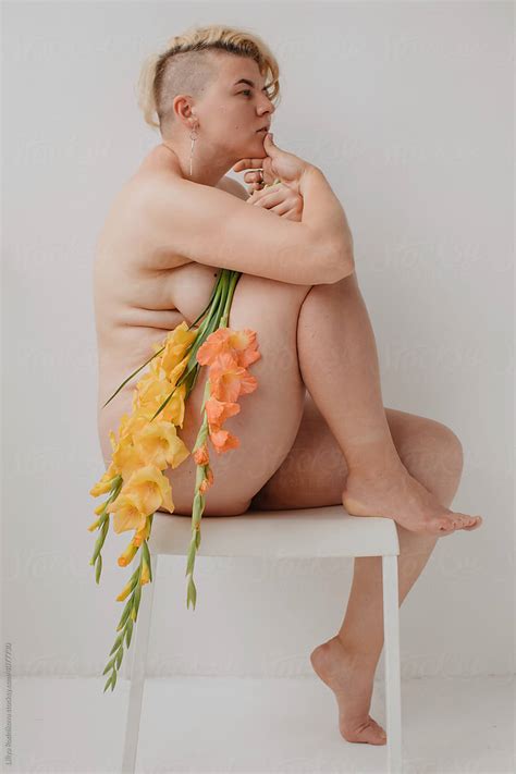 Naked Curvy Woman With Yellow Flowers By Stocksy Contributor Liliya Rodnikova Stocksy