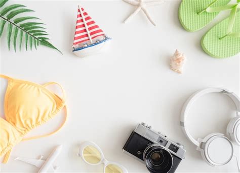 Premium Photo Top View Travel Concept With Bikini Luggage And Outfit Of Traveler On White