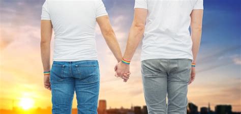 Premium Photo Male Couple With Gay Pride Rainbow Wristbands