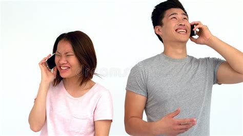 Laughing Asian Couple Eating Popcorn And Wearing Movie Glasses Stock