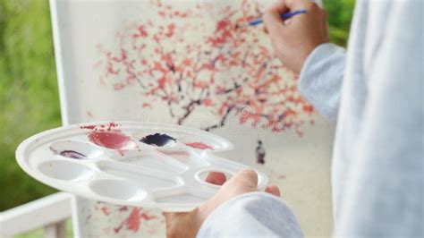 Lifestyle Asian Senior Old Man Painting Picture Artwork Using Brush And