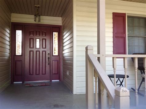 Tan Siding With Wood Shutters A Perfect Match For Your Homes Exterior See How