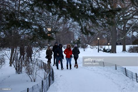 New Yorkers Enjoy Snow As Snowfall Blankets The Central Park In New