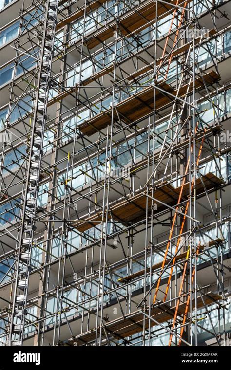 Tall Scaffold Erected For Access On The Side Of A Multi Storey Block Of