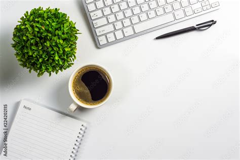 Office Desk With Coffee Cup Blank Notebook Black Pen Laptop Computer