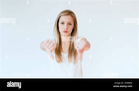 Unhappy Teen Girl Gives Two Thumbs Down Stock Video Footage Alamy