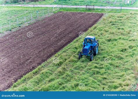 Fertilizing Fields Blue Tractor Fertilizing A Field Farmers Spreading