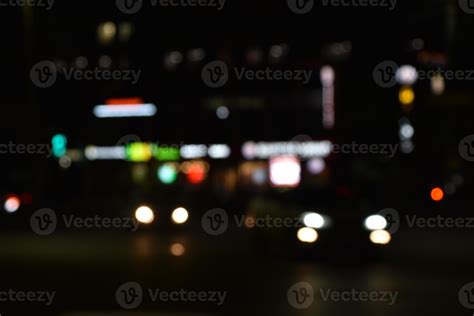 Multicolored lights of the night city. Glowing city road at night. 22723974 Stock Photo at Vecteezy