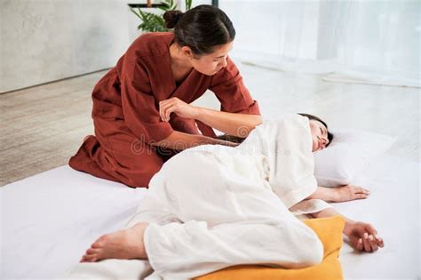 Masseuse Making Thai Yoga Massage Woman Therapist Doing Traditional