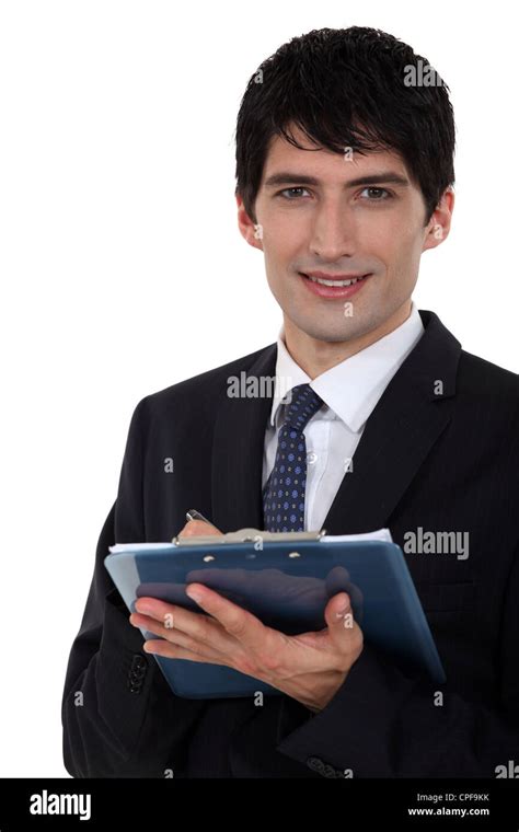 Male Office Worker With Clip Board And Pen Stock Photo Alamy