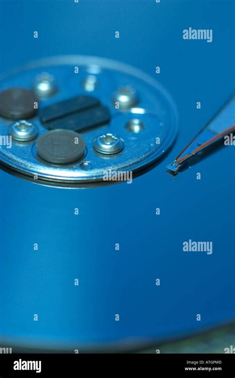 close up of hard disk drive read write head Stock Photo - Alamy