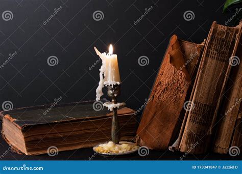 Stack Of Ancient Books And Lighted Candle Stock Image Image Of Candle