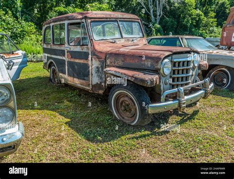 Vintage Old Rusty Willys Jeep Station Wagon Parked Outdoors Fully