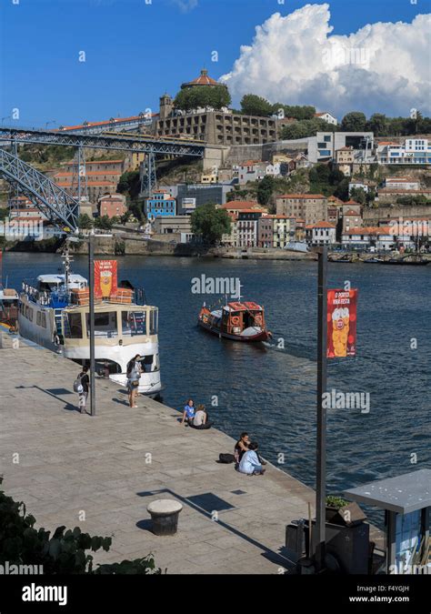 Cais De Ribeira River Douro And A Light Rail Train Crossng The Ponte