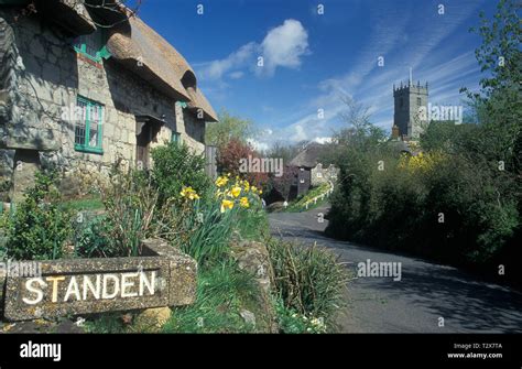 Thatched Cottages And And All Saints Parish Church In Godshill Isle Of