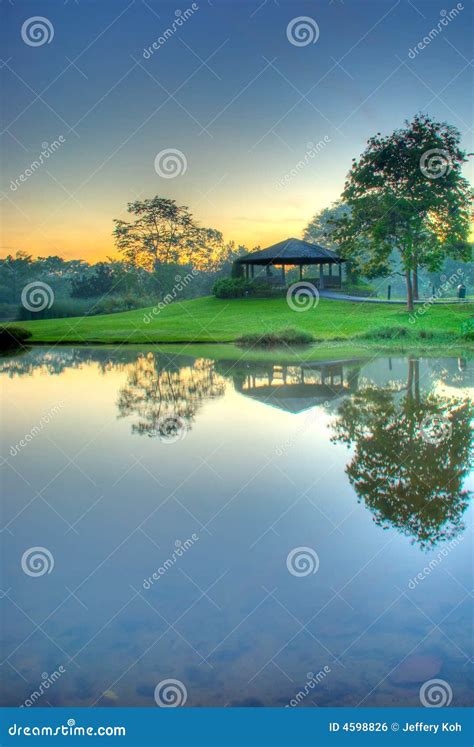 Sunrise Over Still Lake Stock Photo Image Of Pavilion 4598826