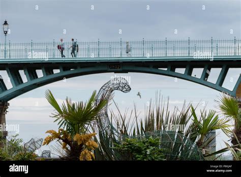 Looking Up To The Spa Bridgescarborough With Two People Walking Across