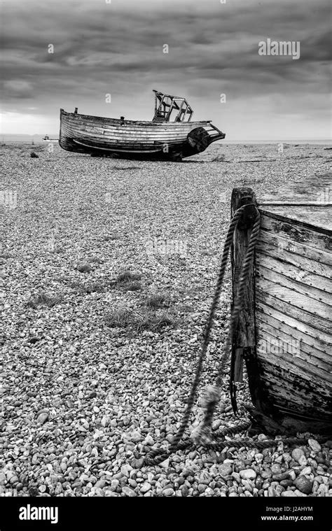 Abandoned Derelict Fishing Boats On Shingle Beach Landscape In Winter