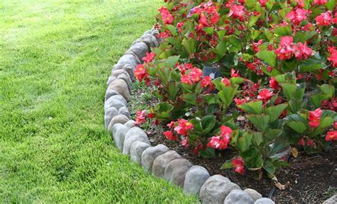 Edging Stones Installed Between A Flower Bed And Lawn Landscaping