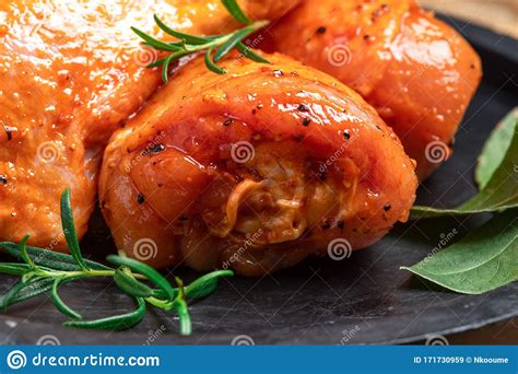 Chicken Legs In A Red Marinade On A Cooking Board Pickled Raw Meat