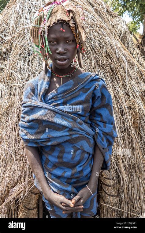 A Traditional Mursi Tribe Young Woman In Traditional Clothing In The