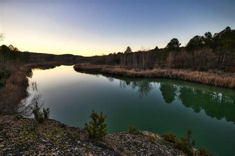 Premium Photo | Calm river in a sunset