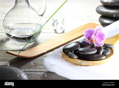 Basalt Stones For Hot Stone Massage With Accessories On Wooden