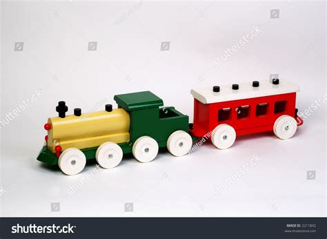 Old Yellow And Green Wooden Toy Locomotive With Red Coach On White ...