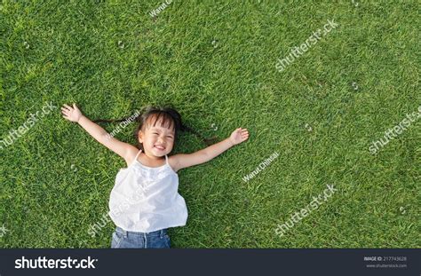 13,145 Child laying in grass Images, Stock Photos & Vectors | Shutterstock