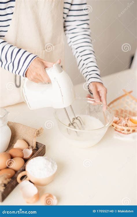 Male Hands Beating Egg Whites Cream with Mixer in the Bowl Stock Photo ...