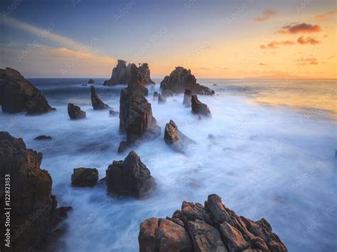 Amazing stones at beach in sunset. Locations in Pegadung Beach Lampung, Indonesia. Stock Photo ...