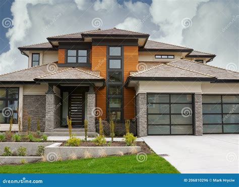 New Canadian Home House Exterior Dramatic Cloudy Cumulus Sky Background