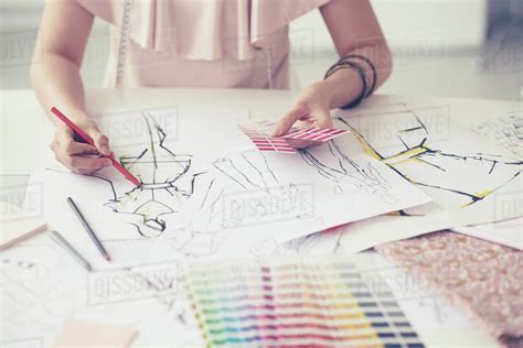 Female Fashion Designer Working On Her Designs In The Studio Stock