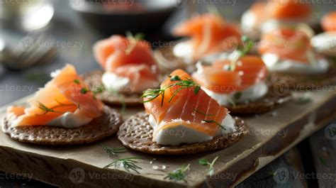 A Platter Of Buckwheat Blinis Topped With Smoked Salmon And A Dollop Of