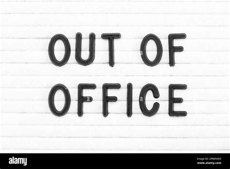 Black Color Letter In Word Out Of Office On White Felt Board Background