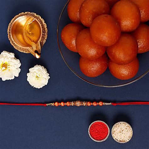 Rose Gold Pearl And Beads Rakhi With 1 Kg Gulab Jamun Tin Uae Gift