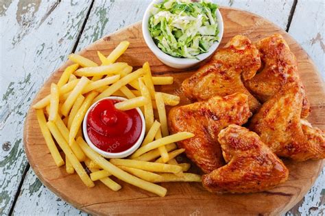 Fried Chicken Wings With French Fries Stock Photo Koss