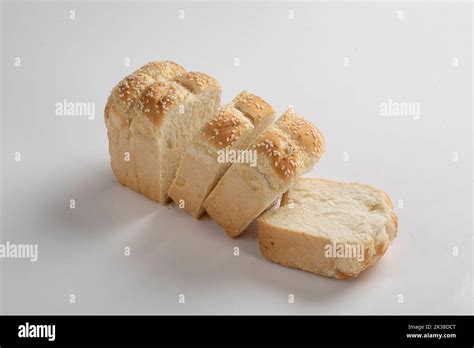 whole wheat bread slices on a white background Stock Photo - Alamy