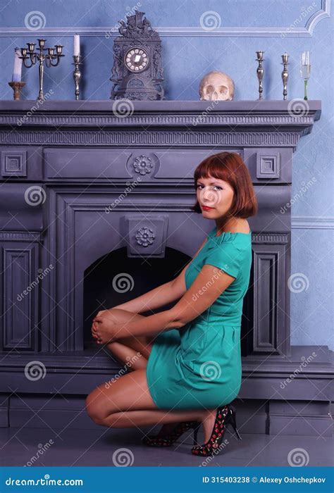 Long Legged Redhead Girl In Shiny Pantyhose And Green Minidress Posing