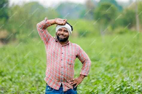 Premium Photo | Happy indian farmer young farmer smiling in farm