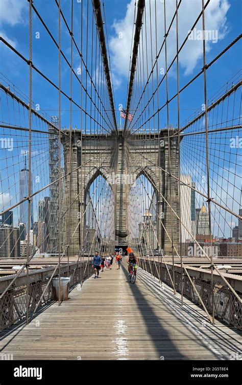 The walkway across the Brooklyn Bridge in New York city has separate ...