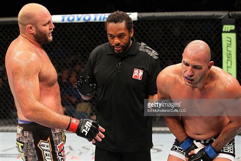 Referee Herb Dean calls a stoppage due to Ben Rothwell (L) kicking ...