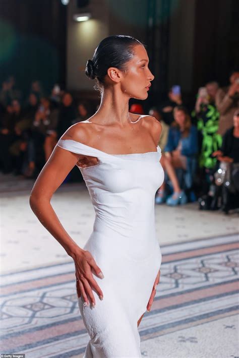 Bella Hadid Takes To The Runway Nude Before Her Dress Is SPRAYED ON In An Incredible Moment At