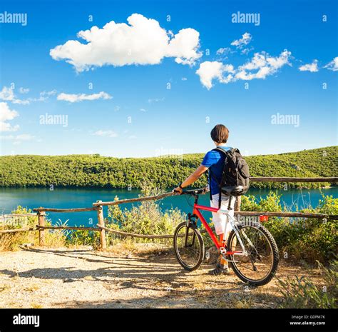 Man with a Bike on Beautiful Nature Background Stock Photo - Alamy