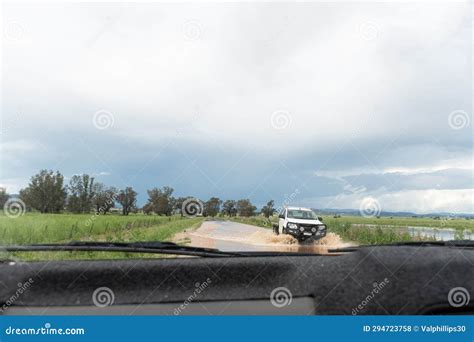 Car Driving On A Road Through Floodwater Splashing Stock Photo Image