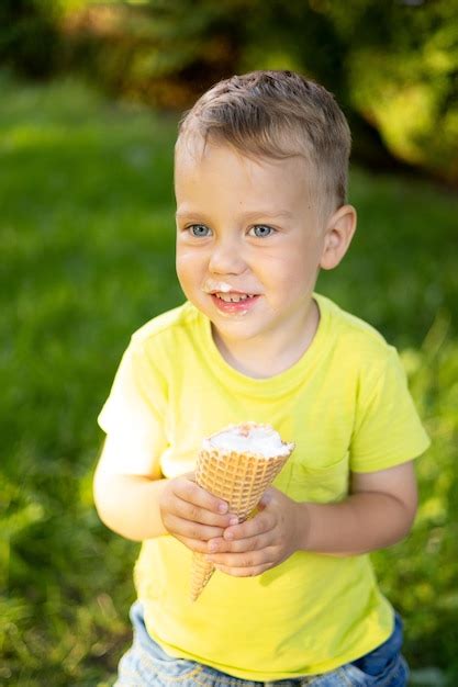 Premium Photo A Beautiful Little Boy With Blue Eyes And Blond Hair