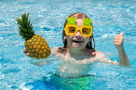 Premium Photo | Child playing in the swimming pool summer kids activity