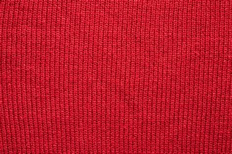 Premium Photo | Red knitted wool texture background